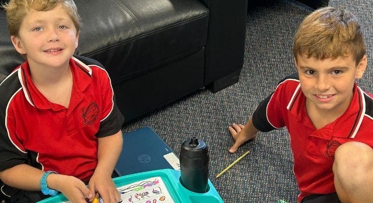 two_students_doing_class_work