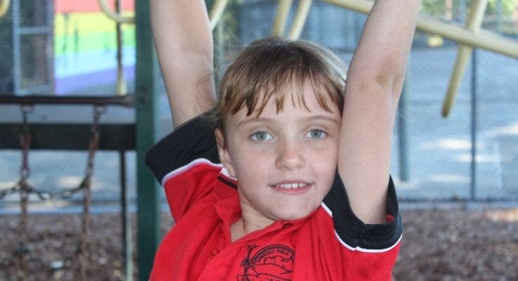 one_student_on_play_equipment