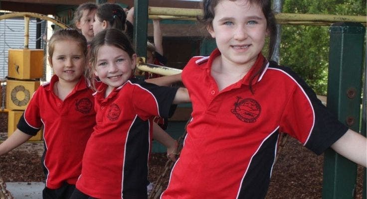 three_girls_on_play_equipment