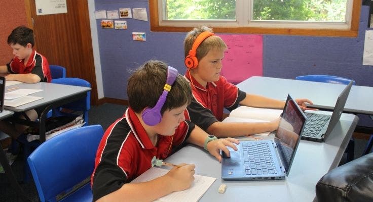 two_boys_using_laptops