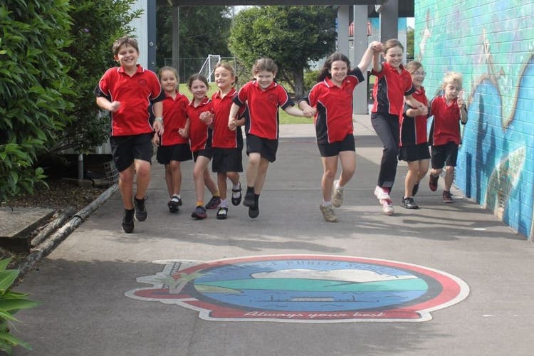 students_holding_hands_and_skipping