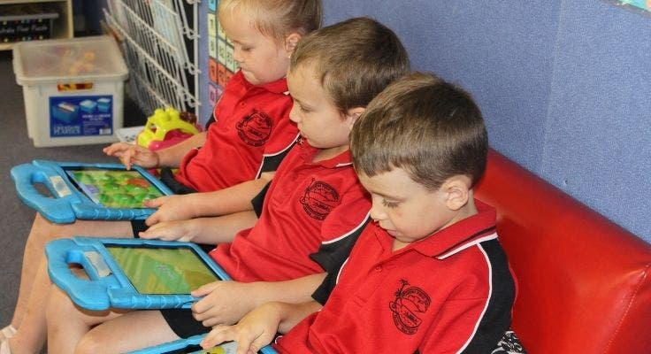 three_kindy_students_using_ipads